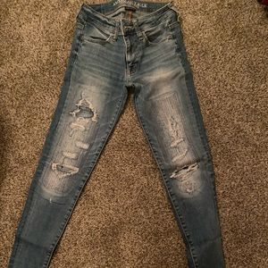 American eagle skinny ripped jeans with patches.